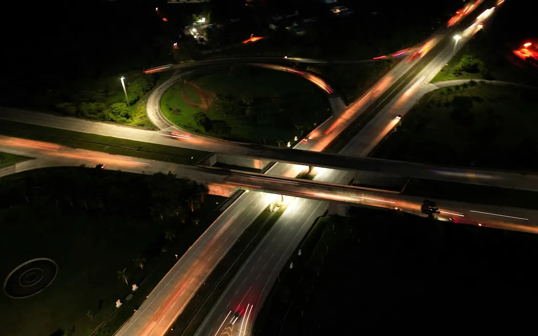 Aerial view of a highway interchange lit at night