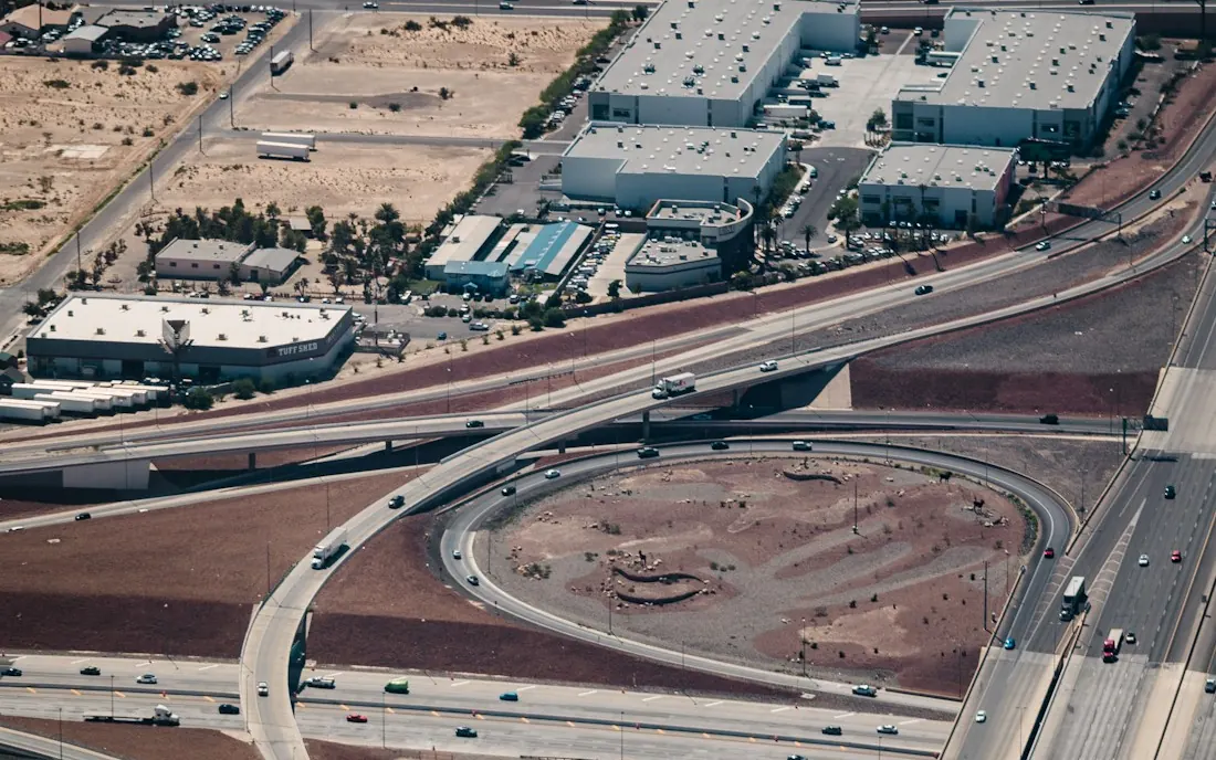 Aerial view of a freeway interchange in desert terrain